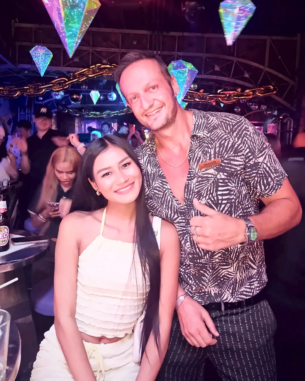 Yannis Pagiannidis on duty at Lucifer Club with a guest